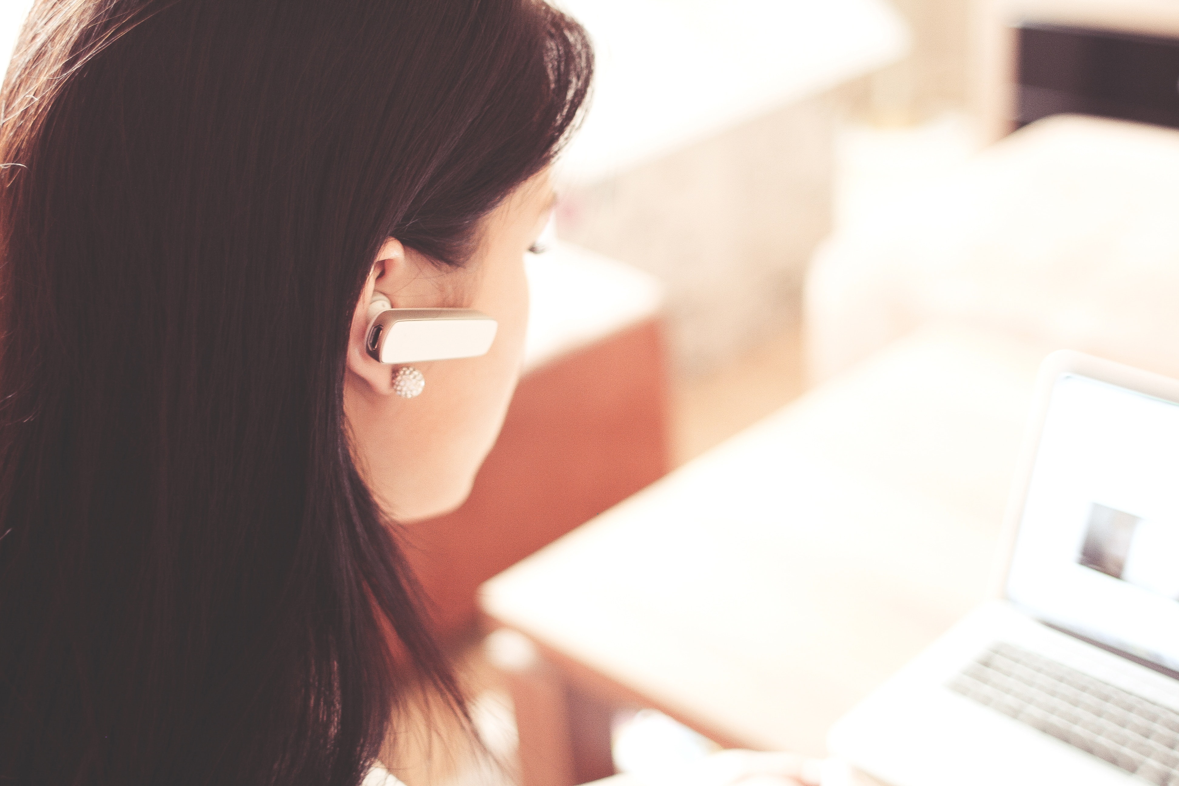 Web Accessibility – a woman wearing ear piece for screen reader